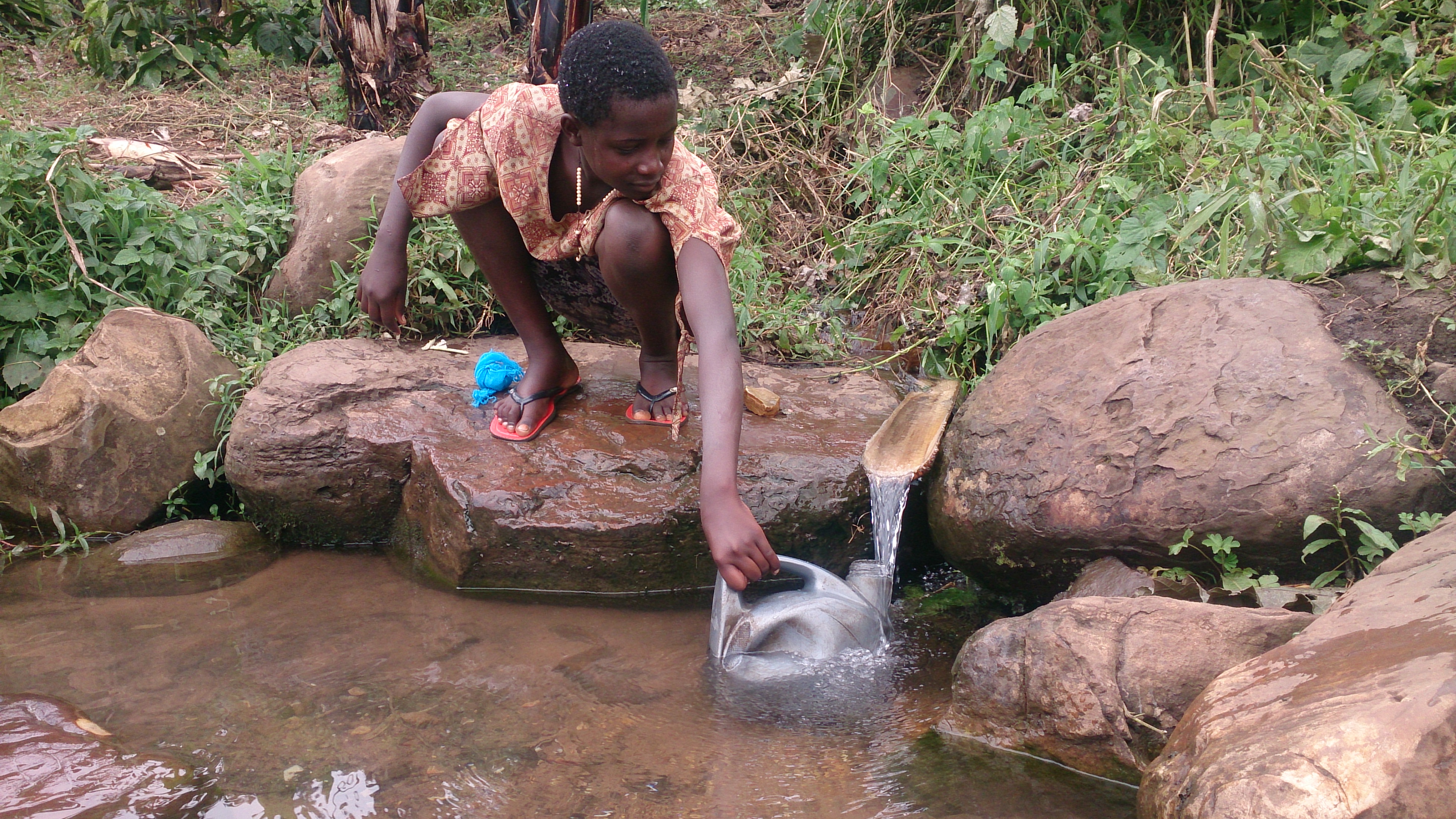 Child collects water