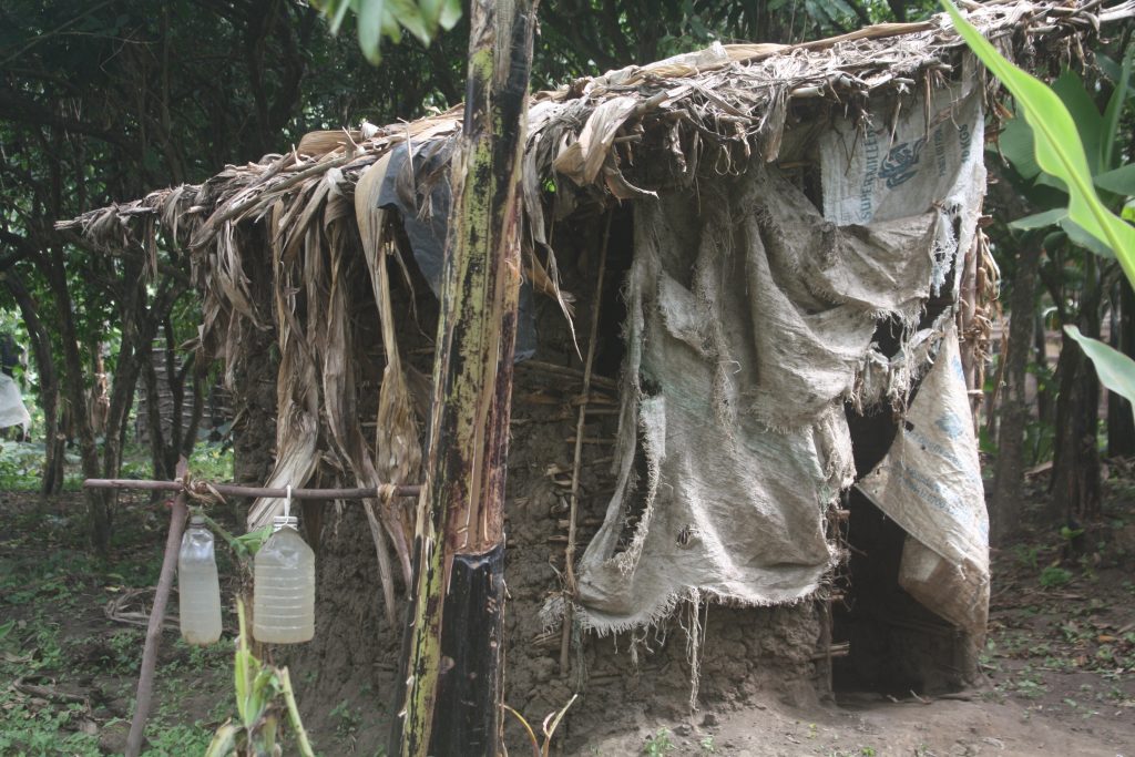 Some of the makeshift pit latrines in Karangura Kabarole district Uganda have water facilities for hand washing but have no soap. Photo by Felix Basiime