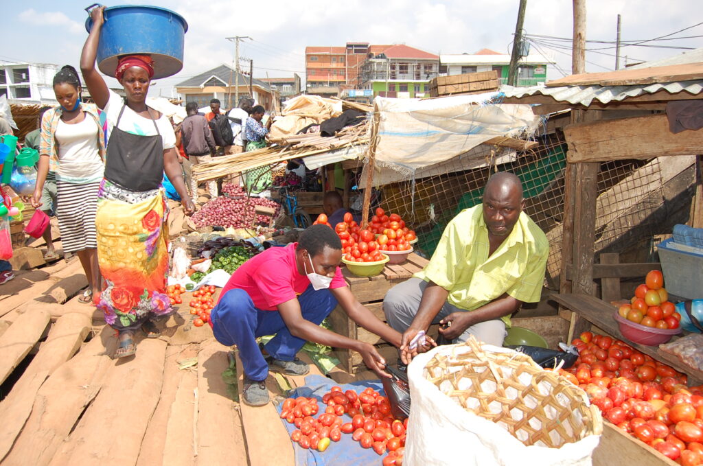 Copy of Traders at Ggaba market have constructed a raised floor on top of water using timber. They think this will work for a mean time with hope that the ground will soon dry.