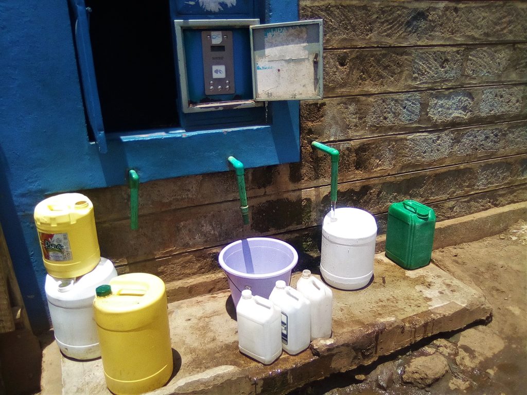 Clean and safe water trickling into jerrycans