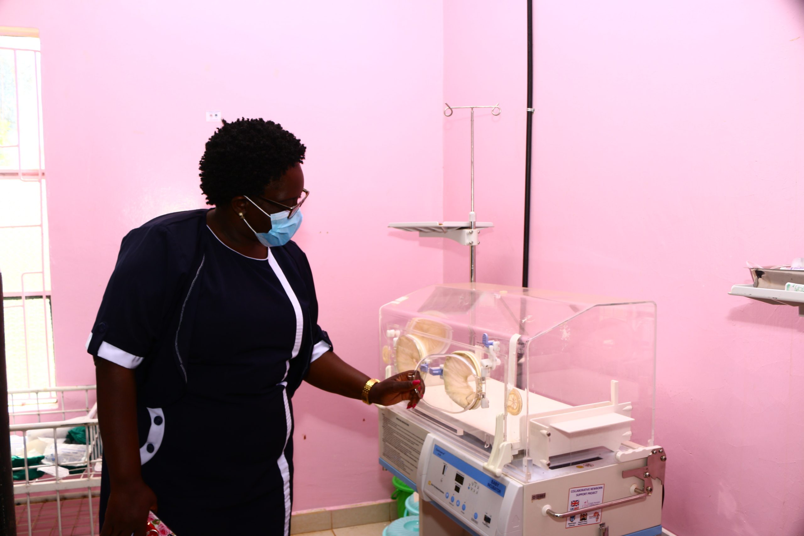 Emily Wamalwa Sub County Public Health Nurse Kapchai Sub County Bungoma County explaining how a solar powered child incubator functions 2 scaled