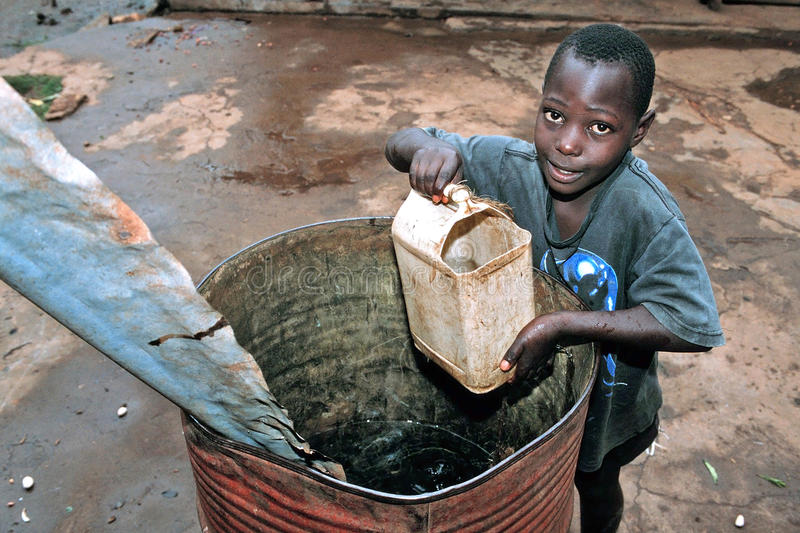 ugandan boy gets drinking water rain barrel uganda village koko village portrait fetch butt corrugated iron 46992071