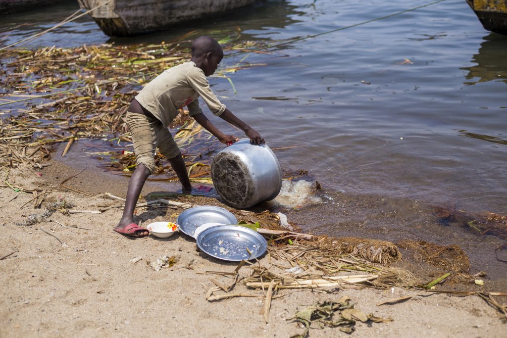 A boy fetching water at Gitaza beach