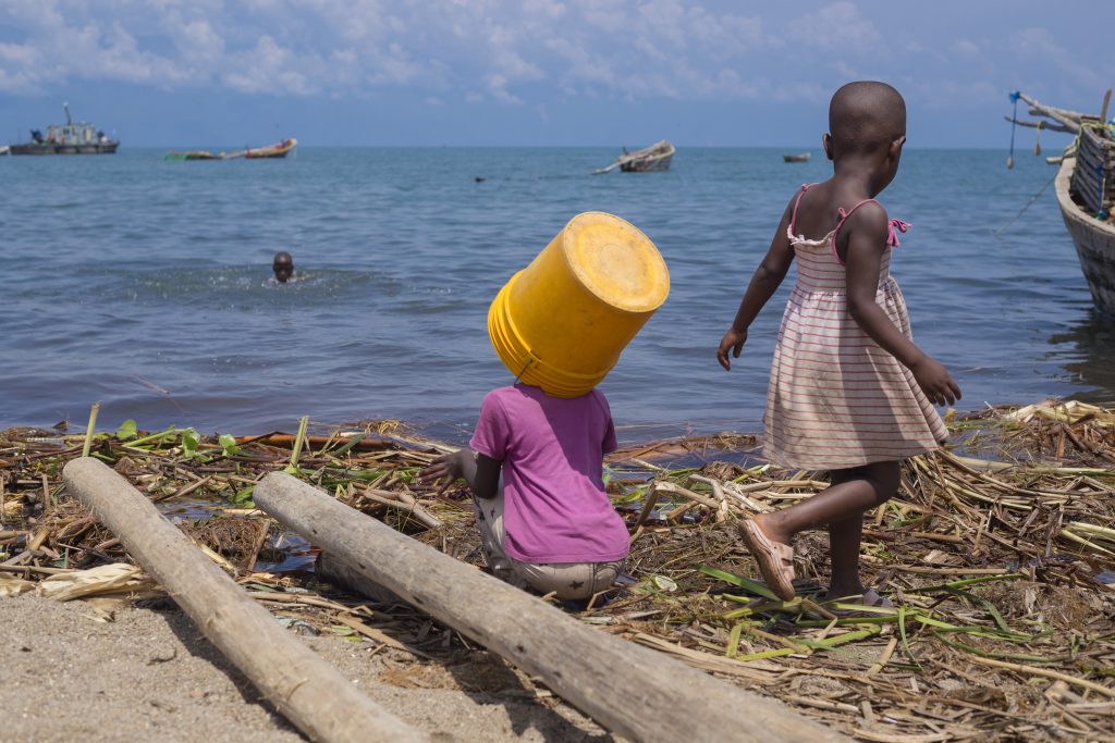 Two girls fetching water at Gitaza