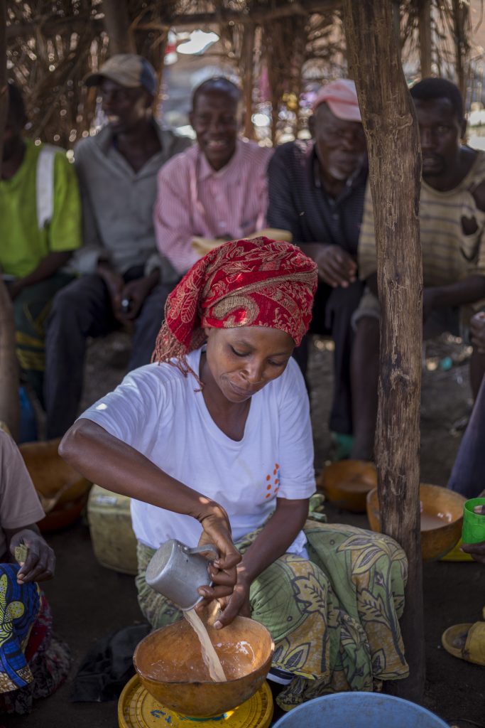woman selling banana beer