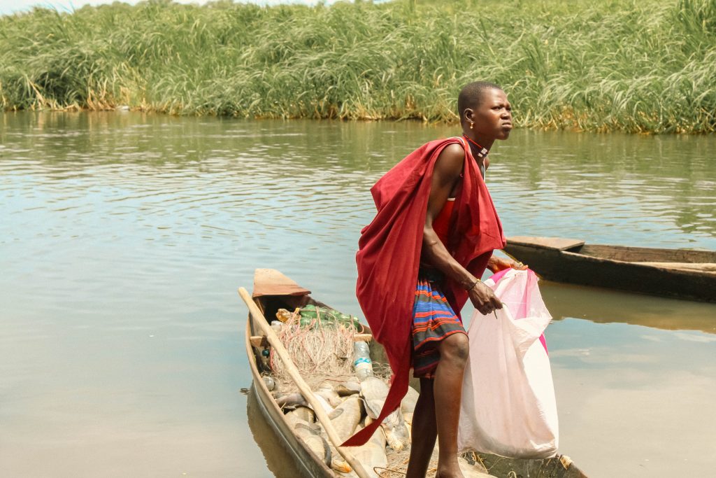 Busines Women in Terekeka County of South Sudan Collecting her Fish on a local Boat Murkab 4 1