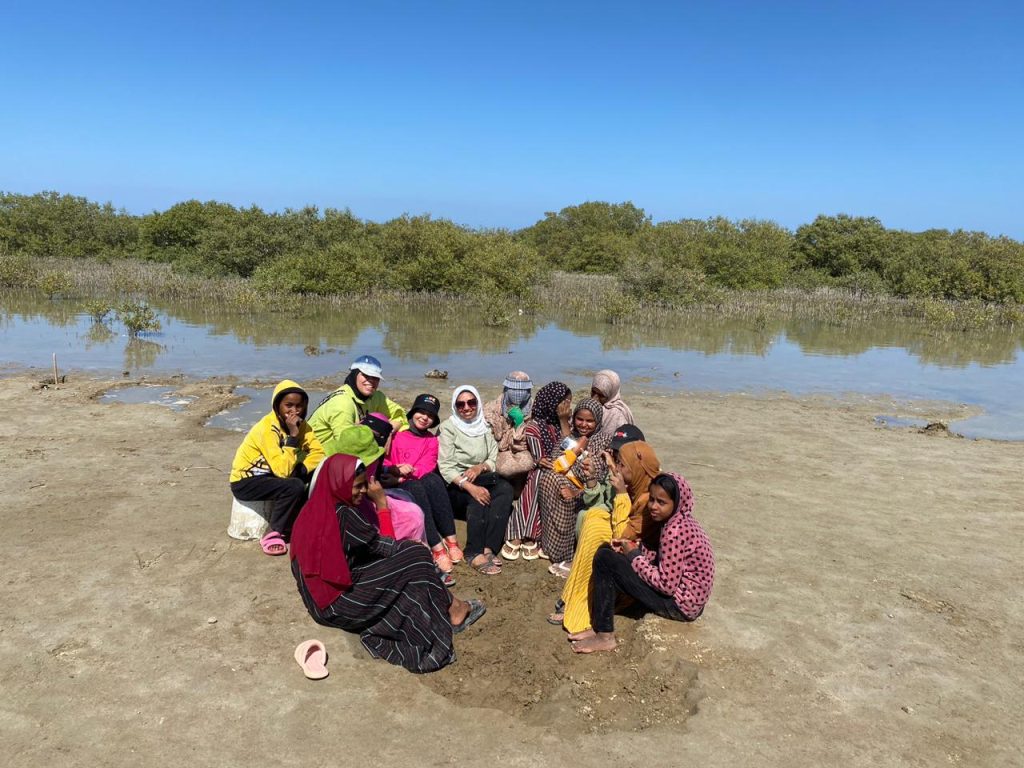 Dr Yasmine and Hamata girls having a break after seeds plantation 1