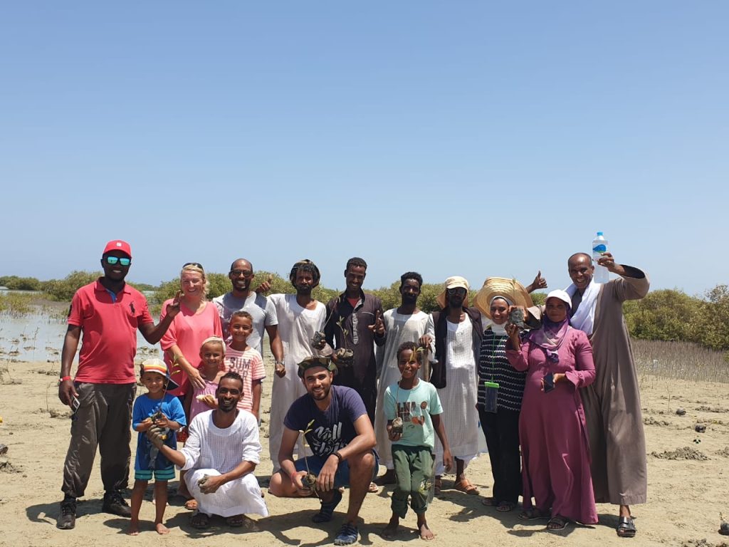 Mers team and community celebrating seedlings transplantation 1