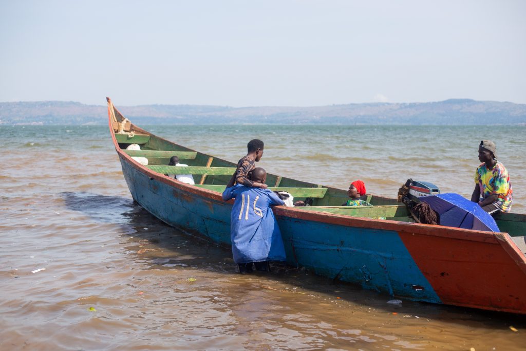 George Kafuko carries a female passenger