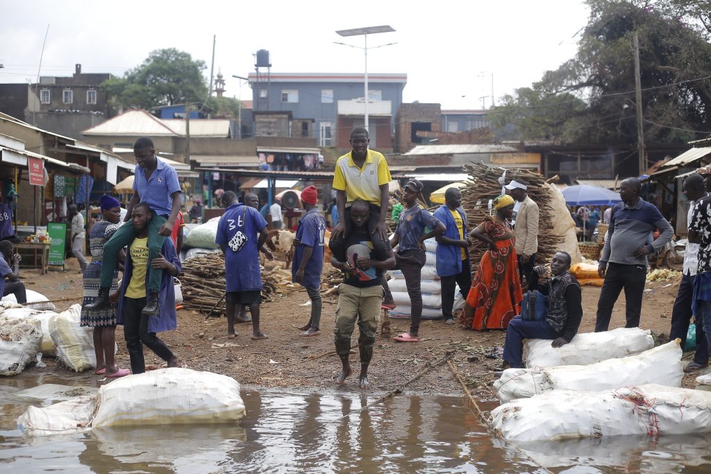 George Kafuko carrying a passenger
