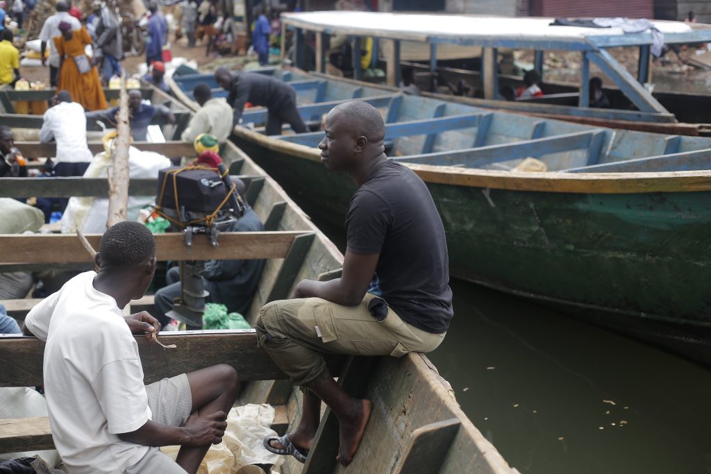 George Kafuko resting on a boat