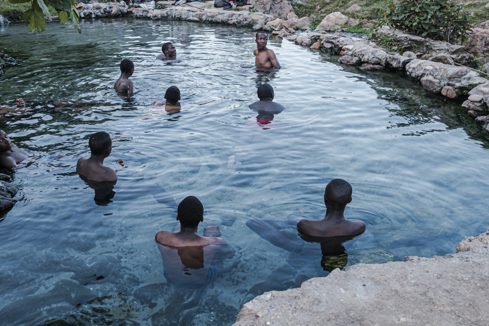 Men swimming close to the source of the Nile 2