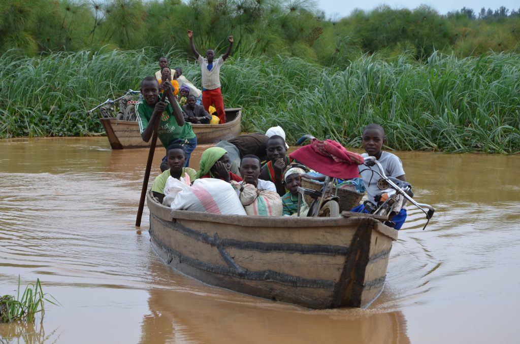 Residents crossing the channel from the market
