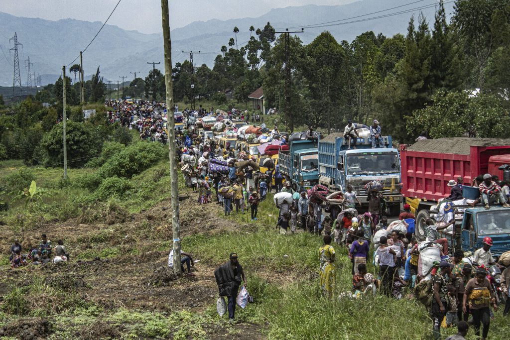 people fleeing in cars