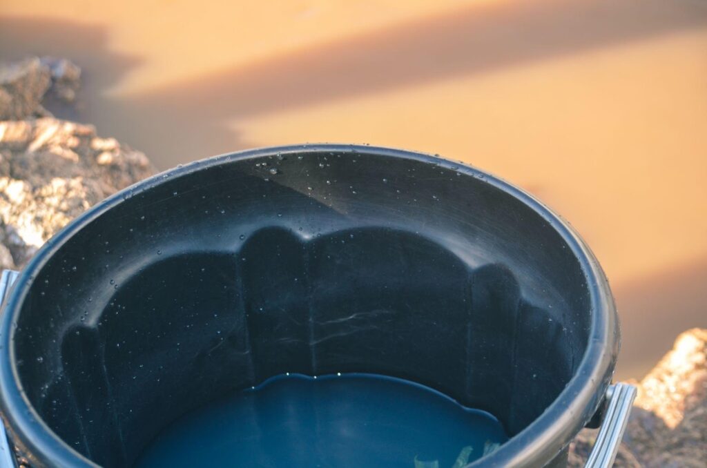 water in a black bucket 2