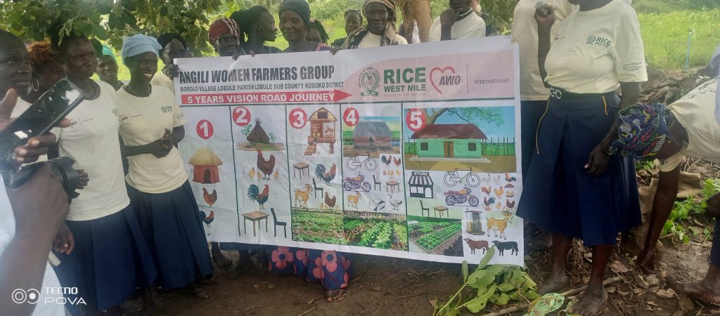 Members of Angili Women Displaying a Banner indicating their Targets in the next five years.@1404817940