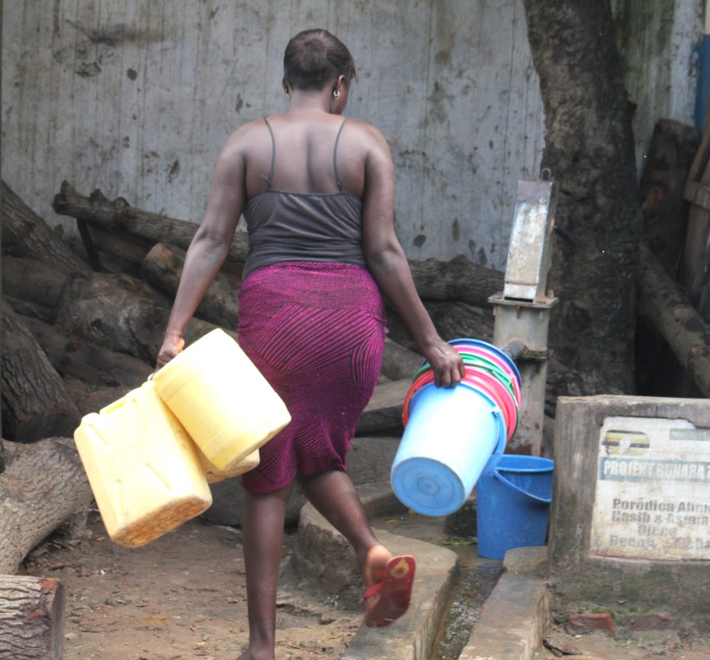Women no longer have to walk long distances in quest for surface water thanks to development of groundwater sources in the area. Photo By Javier Silas Omagor