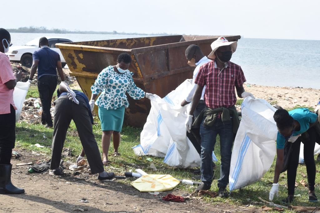 Environmentalists picking plastics from the lake shore during the general cleaning exercise at Lambu landing site 2 2