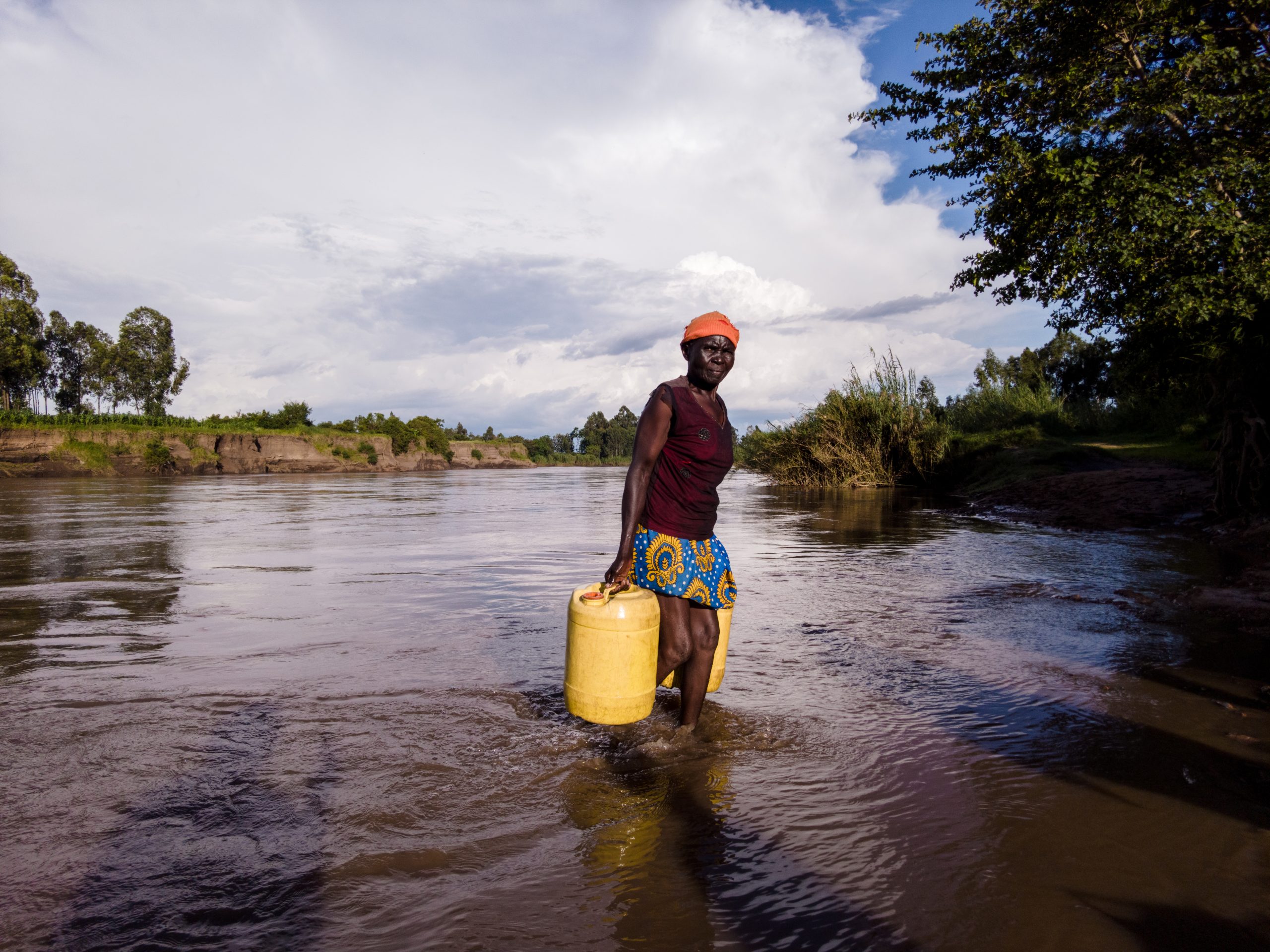 Mary Akinyi fetching water for her 5 donkeys scaled 1